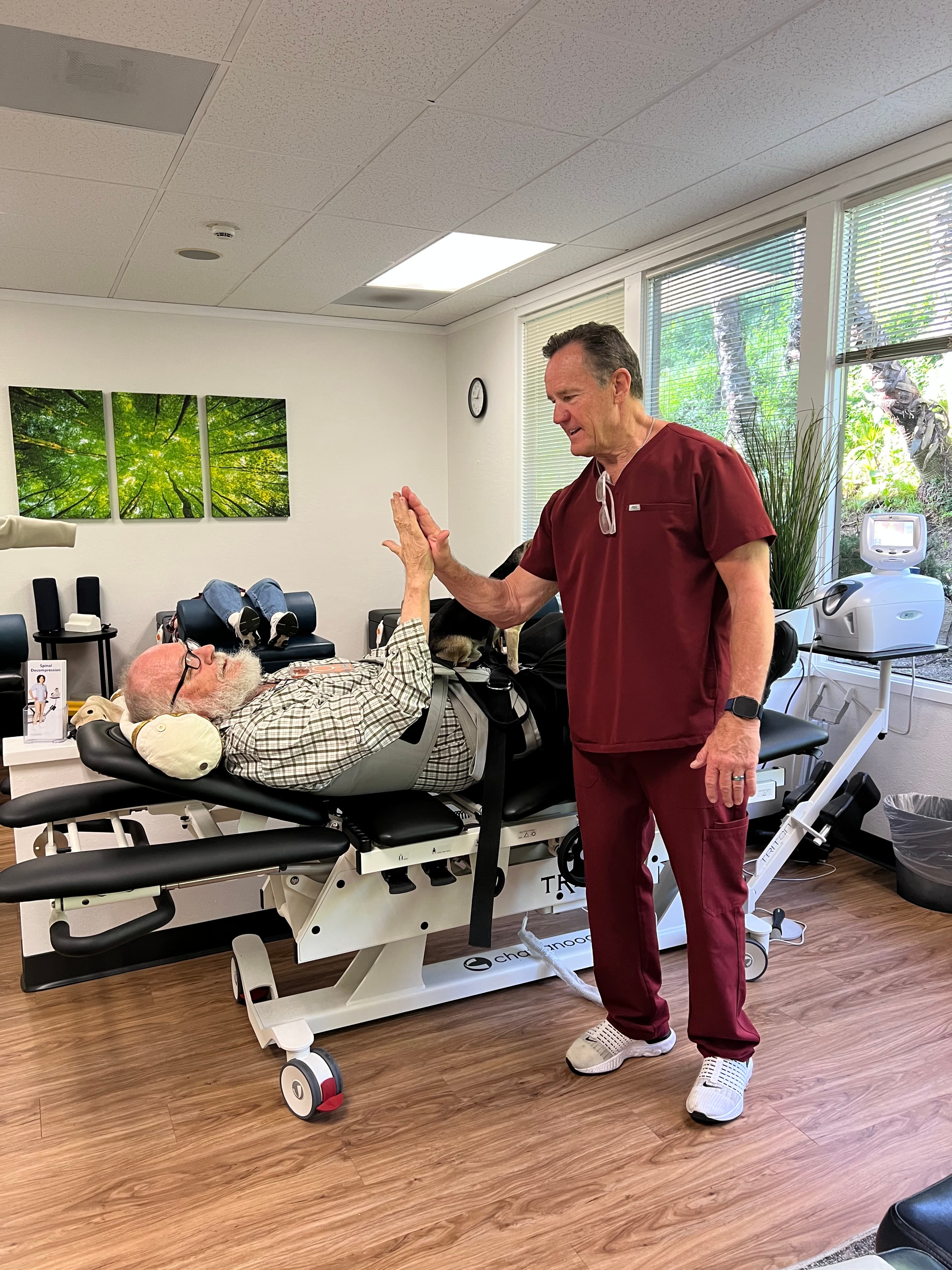 Dr. Craig Petersen treating a patient at Sycamore Chiropractic